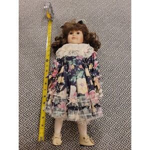 Porcelain Doll With Floral Dress, Jewelry And Shows With Original Paper